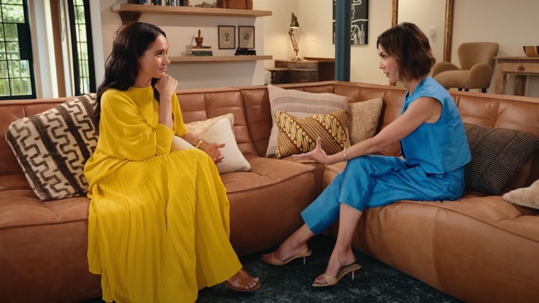 Meghan Markle in yellow on the "Bloomberg Originals" podcast
