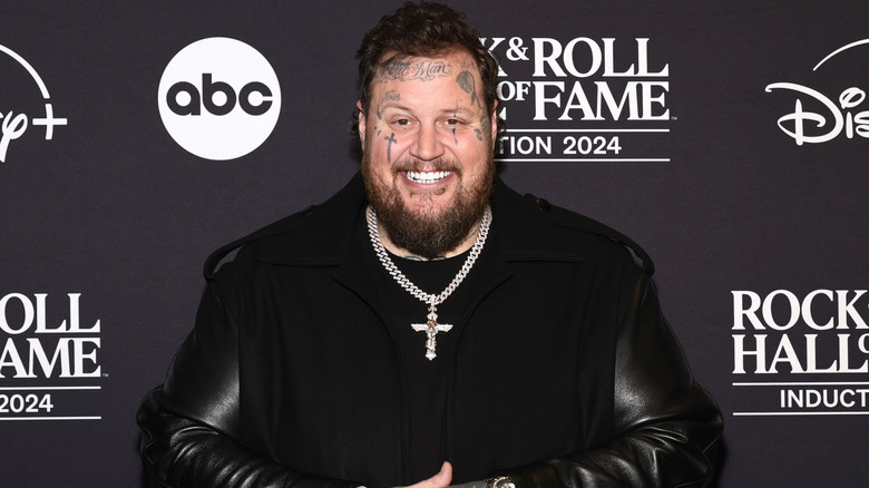 Jelly Roll smiling at the Rock & Roll Hall of Fame induction ceremony in 2024