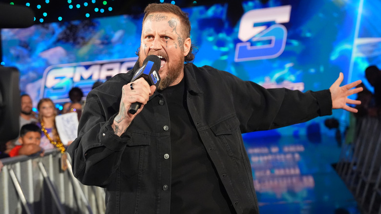 Jelly Roll holding a mic on WWE Smackdown in 2025