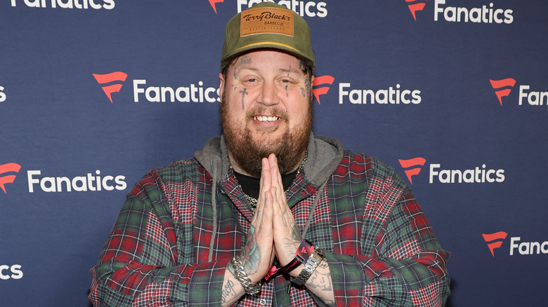 Jelly Roll smiling at Michael Rubin's Fanatics Super Bowl Party in 2024