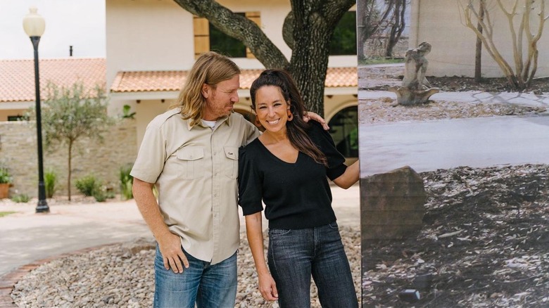Chip Gaines smiling at Joanna Gaines outdoors