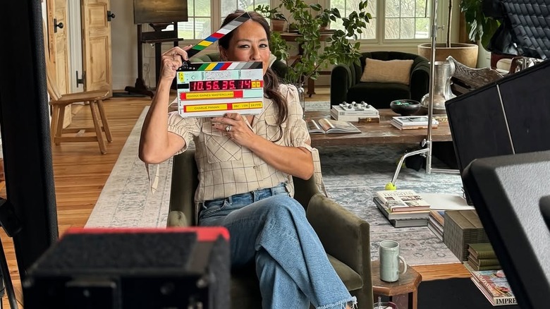 Joanna Gaines holding a clapperboard