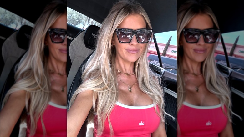 Christina Haack in a selfie on Instagram wearing a red alo top
