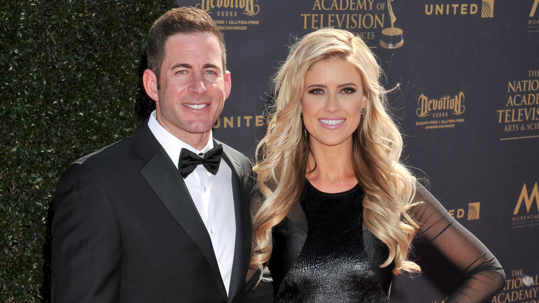 Christina Haack in black and Tarek El Moussa in a black tuxedo at an event