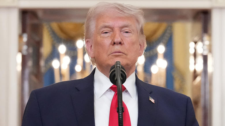 Close-up of President Donald Trump standing in front of a microphone