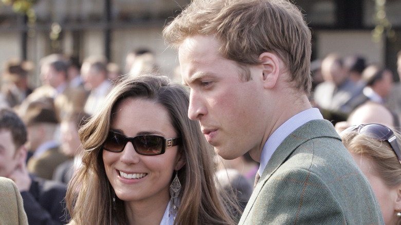 Prince William and Princess Catherine standing in crowd in 2007