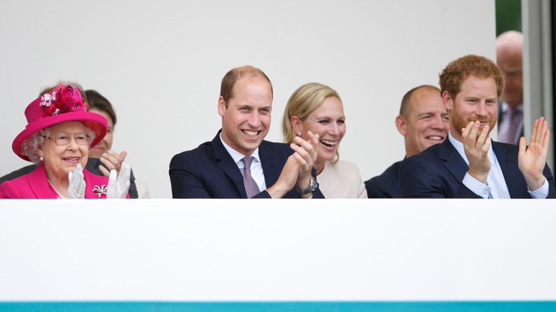 Queen Elizabeth, Prince William, Zara Tindall, Mike Tindall, and Prince Harry clapping and laughing in royal private box