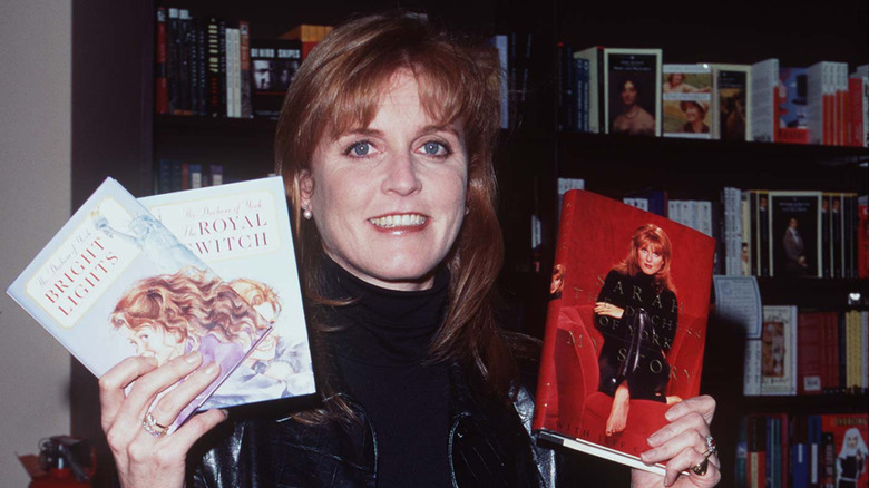 Sarah Ferguson holding her books, including "My Story", at a 1996 book signing
