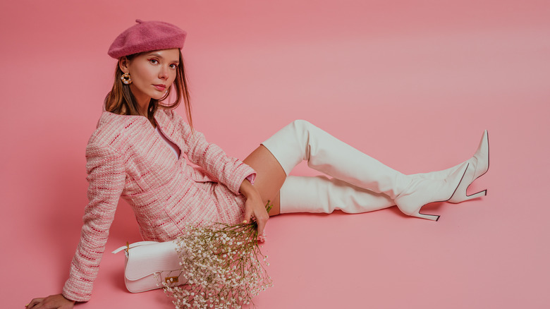 Girl in white knee-high boots