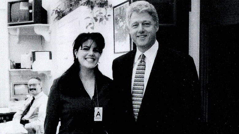Monica Lewinsky posing with Bill Clinton at a White House function in 1998