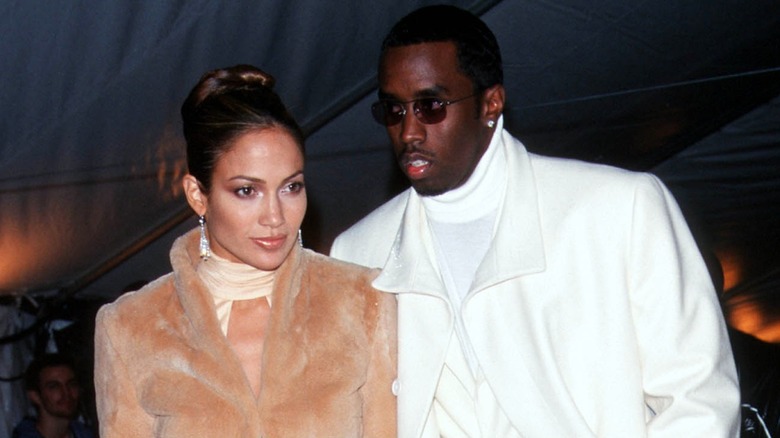 Jennifer Lopez and Diddy posing together at the 1999 Met Gala