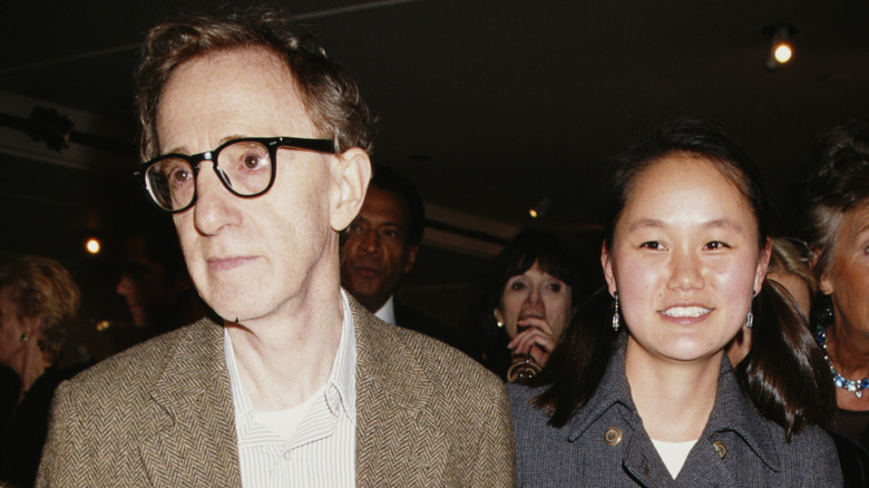 Woody Allen with Soon-Yi Previn at a cocktail party