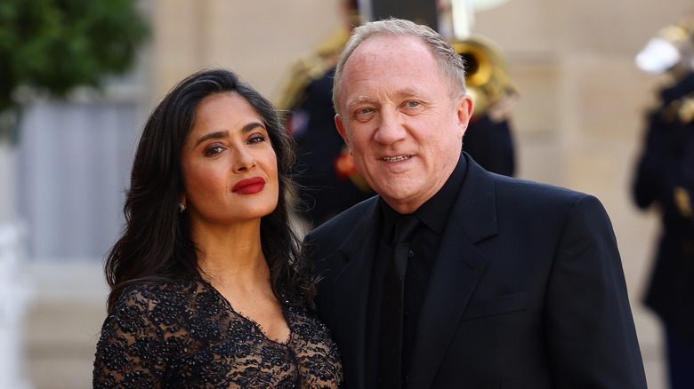Salma Hayek and François-Henri Pinault twinning in black
