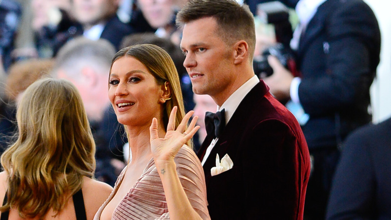 Gisele Bündchen and Tom Brady on a red carpet before their divorce
