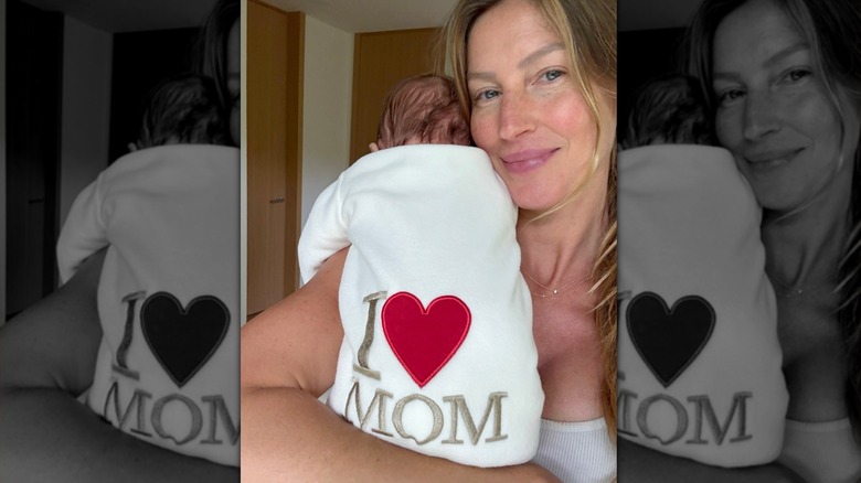 Gisele Bündchen holding her baby