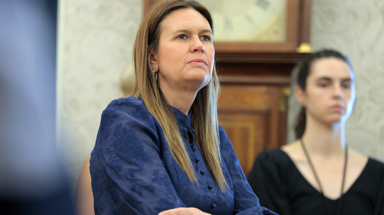 Sarah Huckabee Sanders looking at someone out of the frame