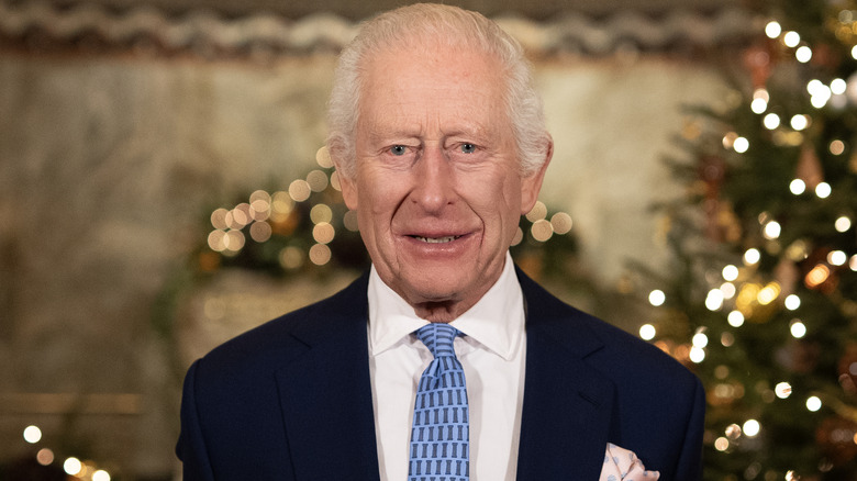 King Charles poses for a photo