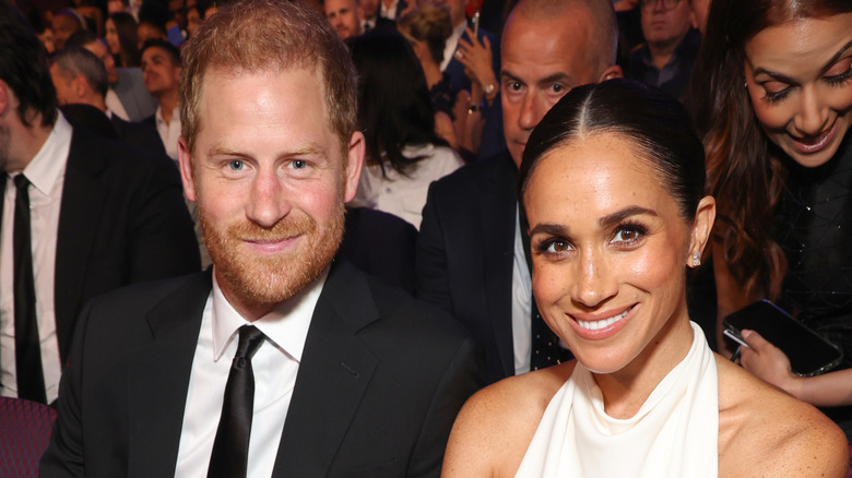 Prince Harry and Meghan Markle pose for a photo