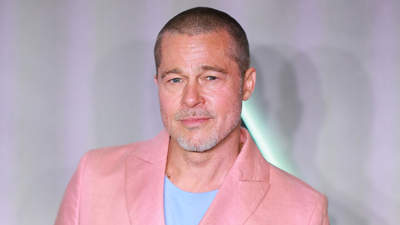 Brad Pitt posing at an event
