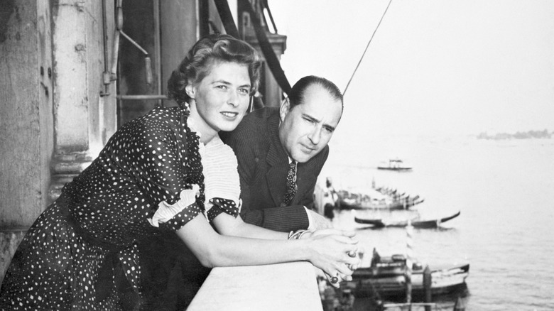 Ingrid Bergman and Roberto Rossellini looking over a ledge at the waters of Venice