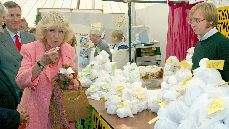 Camilla tasting food at event 