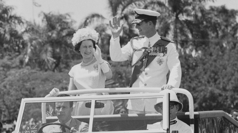 Prince Philip and Queen Elizabeth waving on tour in 1963