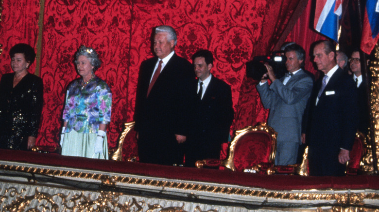 A middle-aged Queen Elizabeth II and Prince Philip with others in the royal box at the ballet