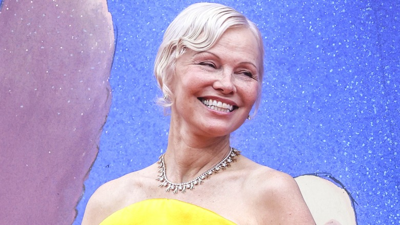 Pamela Anderson smiling at the 2026 Venice Film Festival.