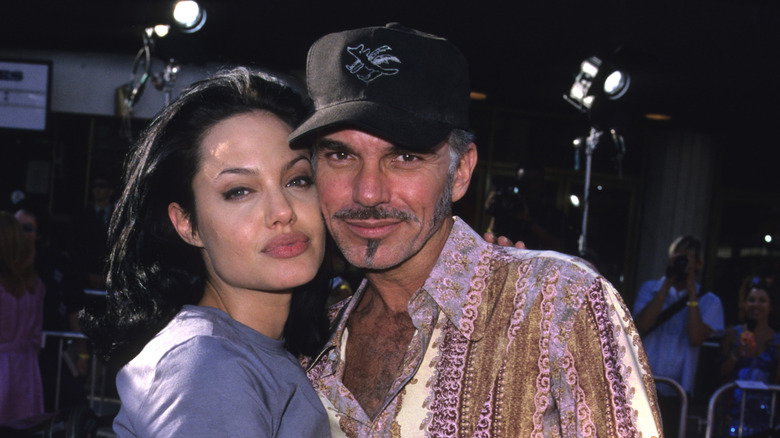 Angelina Jolie cuddling up to Billy Bob Thornton in the early 2000s