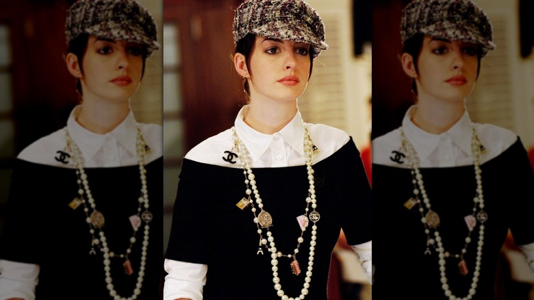Anne Hathaway as Andy Sachs wearing a Chanel cap and necklace in "The Devil Wears Prada."