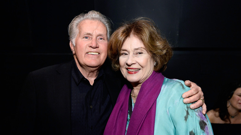 Martin Sheen smiling with an arm around his wife Janet Sheen.