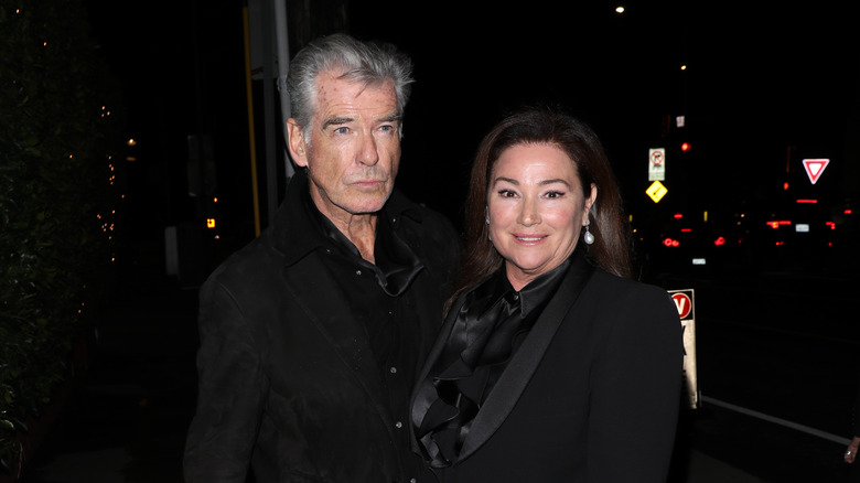 Pierce Brosnan and Keely Shaye Smith twinning in black.