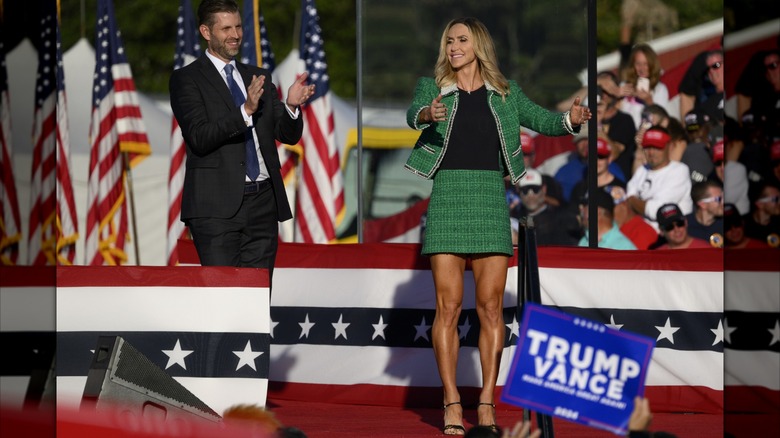 Eric and Lara Trump clapping at a Trump campaign event in North Carolina, 2024.