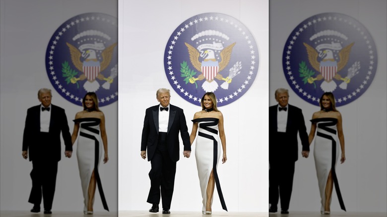 Melania and Donald Trump walking together at the 2025 Commander-in-Chief Ball.