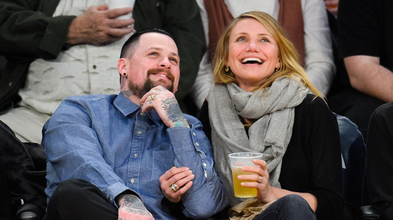 Cameron Diaz and Benji Madden at a basketball game