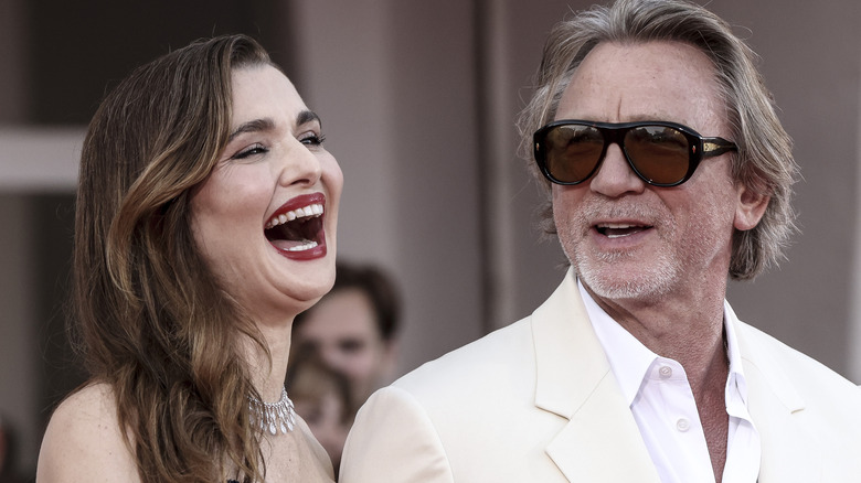 Daniel Craig looks at Rachel Weisz laughing