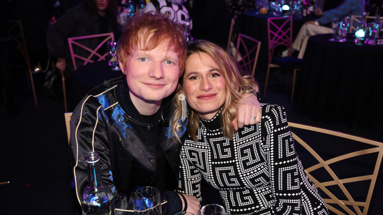 Ed Sheeran with arm around Cherry Seaborn's shoulder