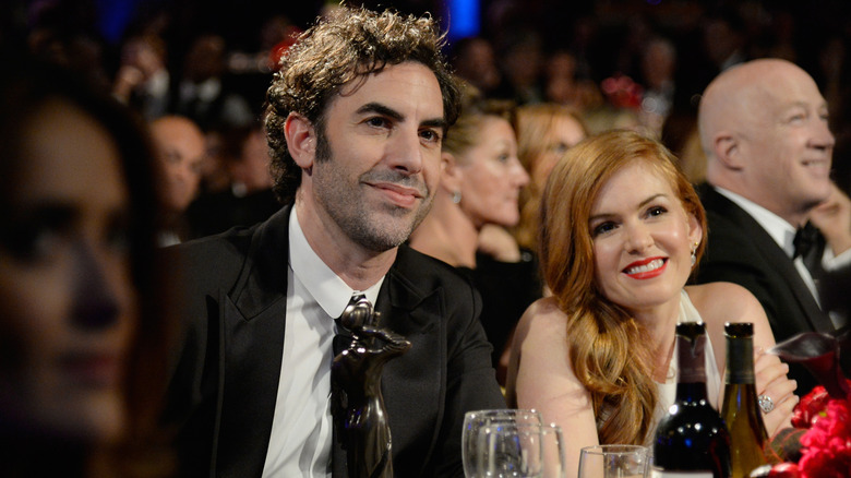 Sacha Baron Cohen and Isla Fisher smiling at an awards show