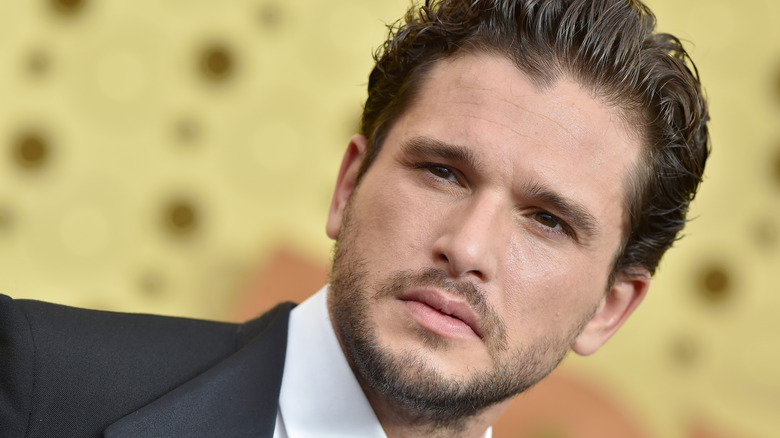 Kit Harrington attending a red carpet event.