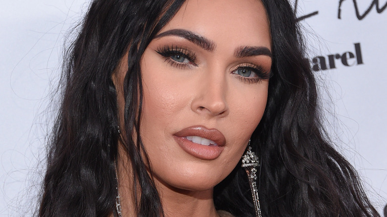 A close-up portrait of Megan Fox at an event.