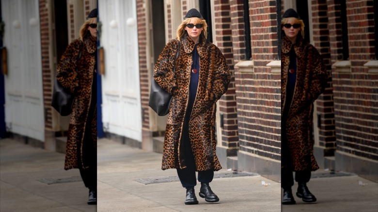 Jennifer Lawrence in  a big coat walking down the street