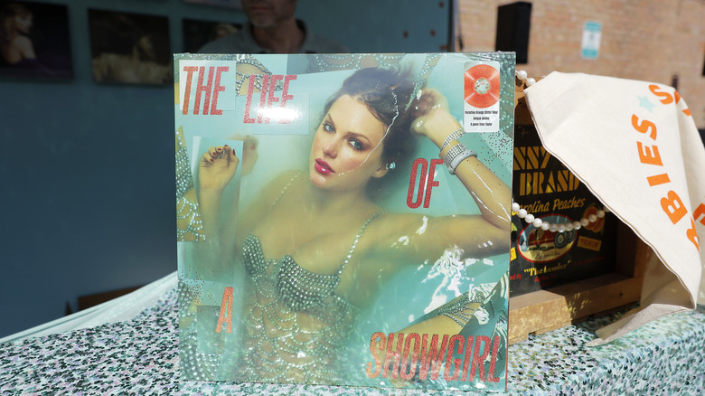 Taylor Swift on the cover of "The Life of a Showgirl"