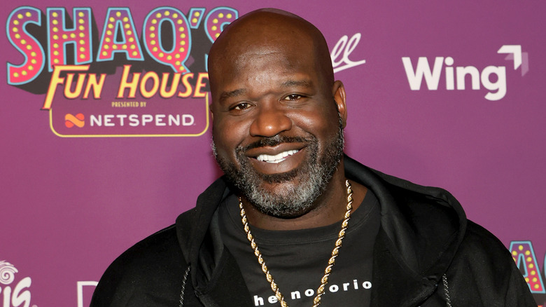 Shaquille O'Neal smiling at a Shaq's Fun House event