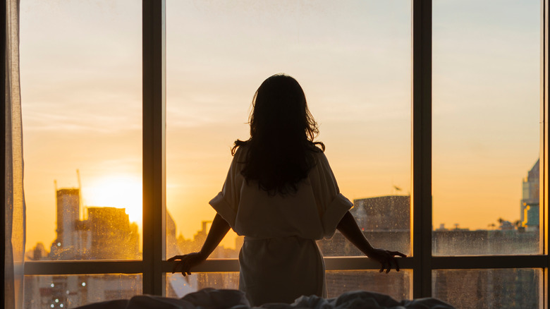 Woman watching the sunrise