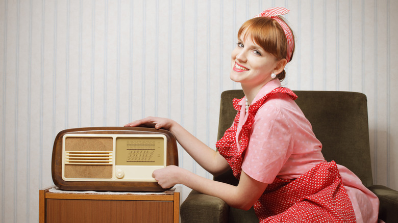 50s-style, white housewife listening to vintage radio