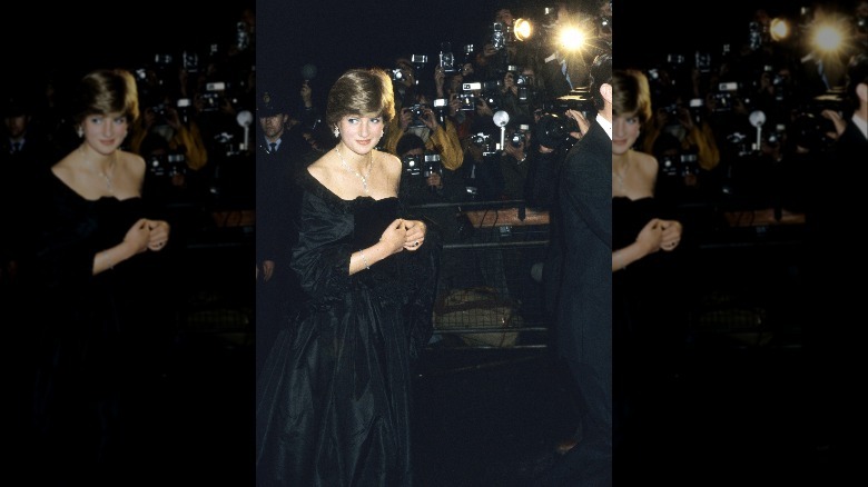Princess Diana wearing black in front of the press