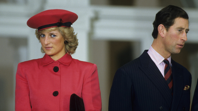 Princess Diana and Prince Charles, looking in different directions