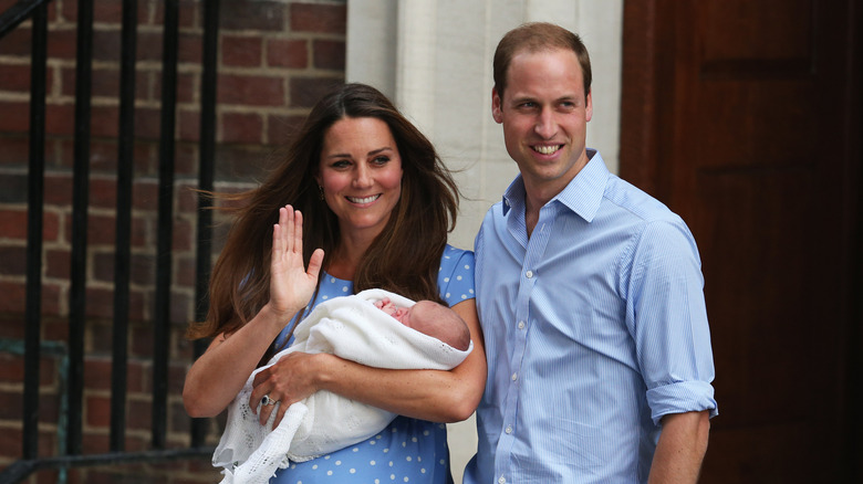 Prince William and Kate Middleton exiting St Mary's Hospital with their newborn Prince George
