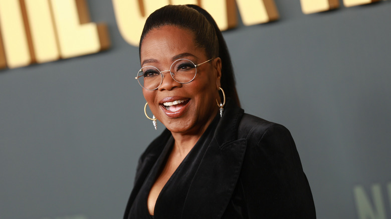 Oprah Winfrey in all black and long ponytail