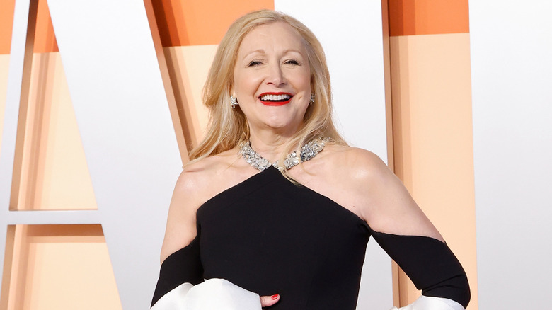 Patricia Clarkson smiling in a black and white gown